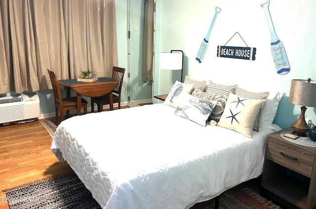 bedroom featuring hardwood / wood-style floors