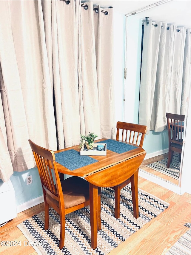 dining space with light wood-type flooring