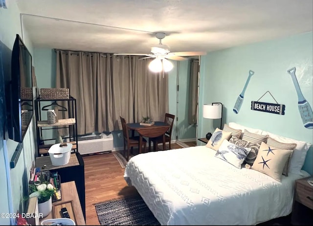 bedroom featuring hardwood / wood-style floors and ceiling fan