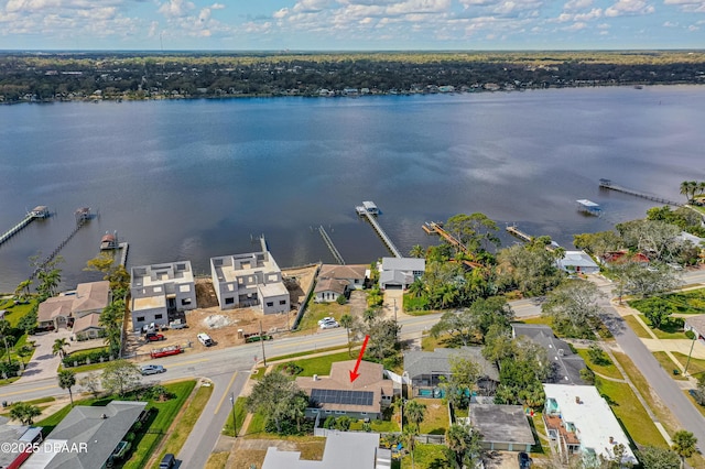 bird's eye view with a residential view and a water view