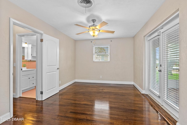 unfurnished bedroom with access to exterior, visible vents, baseboards, and wood finished floors