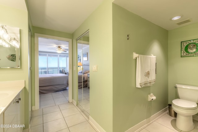 bathroom featuring ceiling fan, tile patterned flooring, vanity, and toilet