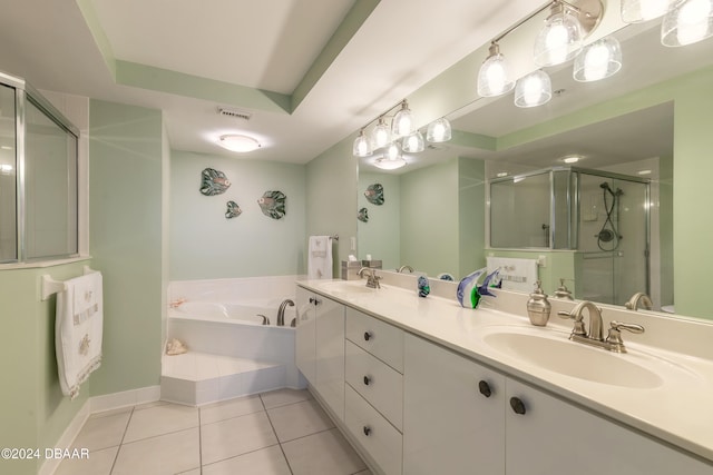 bathroom with tile patterned flooring, vanity, a raised ceiling, and plus walk in shower