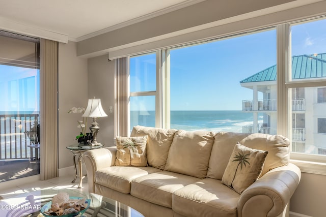 tiled living room featuring a water view and crown molding