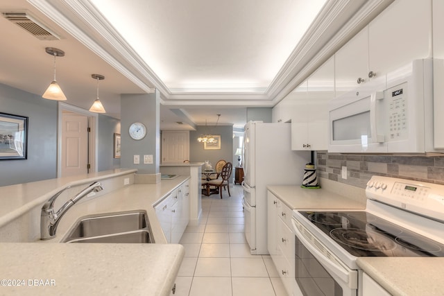 kitchen featuring pendant lighting, white appliances, white cabinets, sink, and decorative backsplash