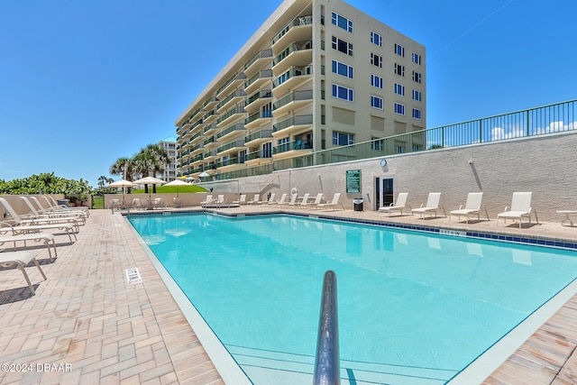 view of swimming pool featuring a patio area