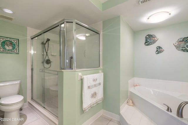 bathroom featuring tile patterned flooring, independent shower and bath, and toilet