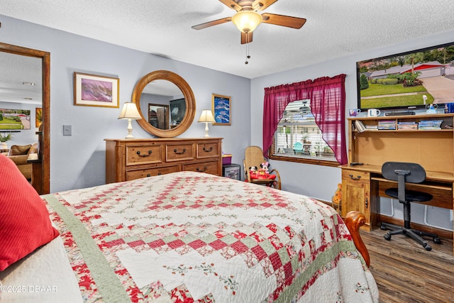 bedroom featuring ceiling fan, dark wood-type flooring, and a textured ceiling