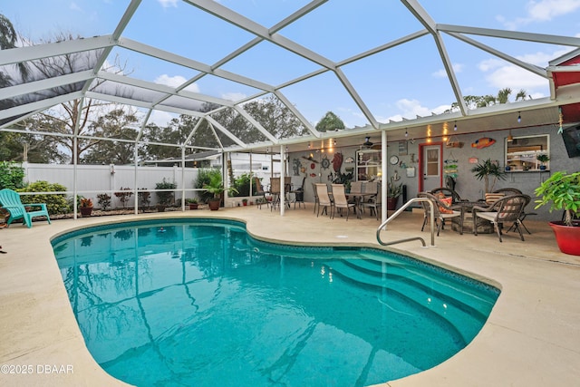 view of pool featuring a patio area and glass enclosure