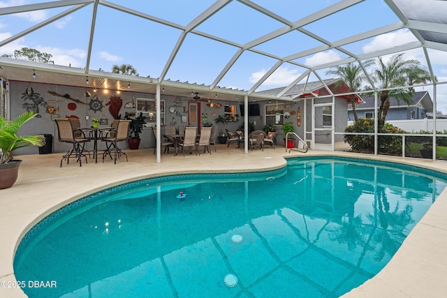 view of pool with a lanai and a patio area