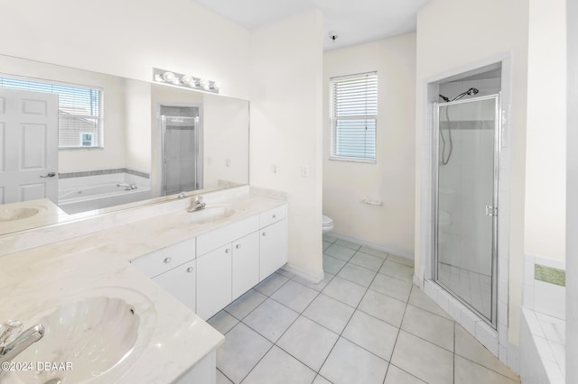 full bathroom featuring tile patterned flooring, vanity, separate shower and tub, and toilet