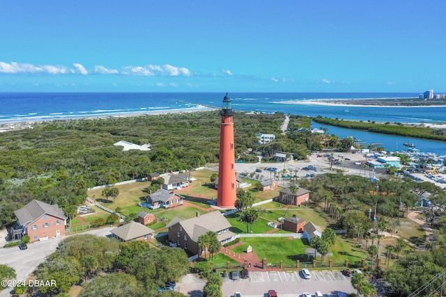 drone / aerial view with a beach view and a water view