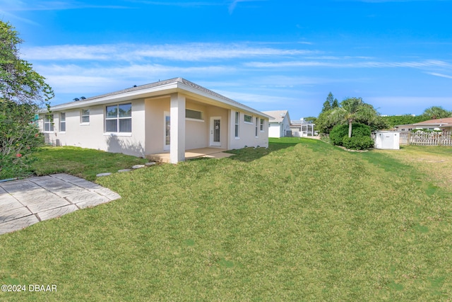 exterior space with a lawn and a patio