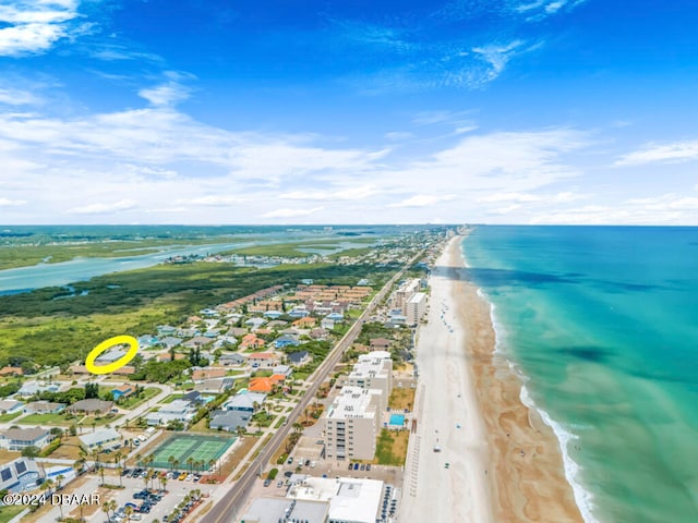 bird's eye view with a water view and a view of the beach