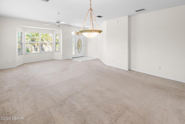 51 Sundunes Cir, Ponce Inlet, FL 32127 - carpeted spare room featuring ceiling fan and baseboards