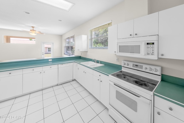 kitchen featuring white cabinetry, sink, ceiling fan, white appliances, and light tile patterned flooring