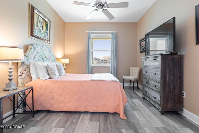 bedroom featuring hardwood / wood-style flooring and ceiling fan