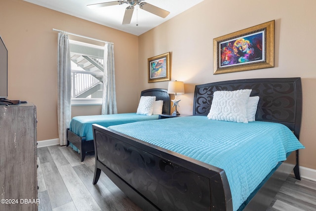 bedroom featuring hardwood / wood-style floors and ceiling fan