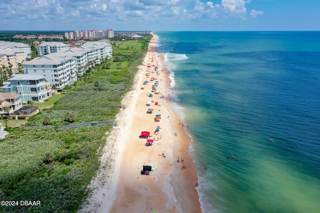 aerial view featuring a water view and a beach view