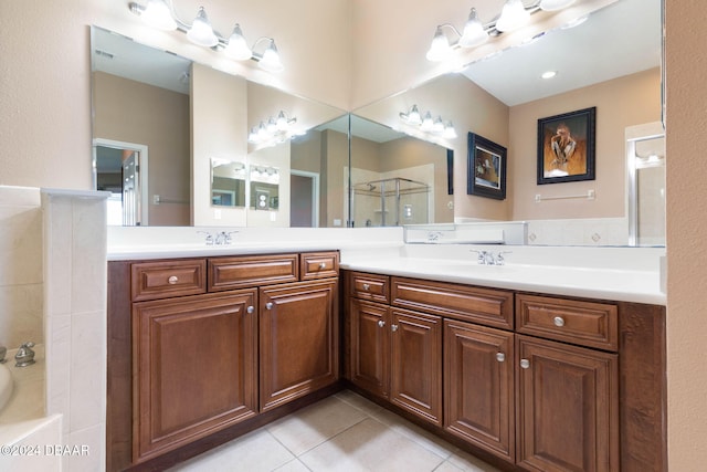 bathroom featuring tile patterned flooring, vanity, and plus walk in shower