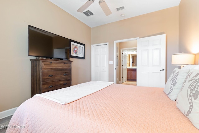 bedroom with ensuite bath, ceiling fan, and a closet