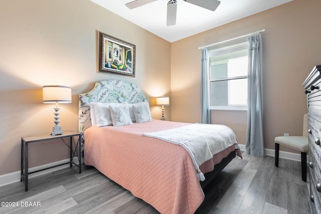 bedroom featuring hardwood / wood-style flooring and ceiling fan