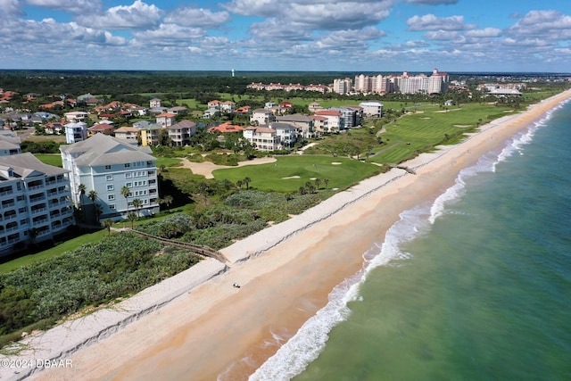 birds eye view of property with a beach view and a water view