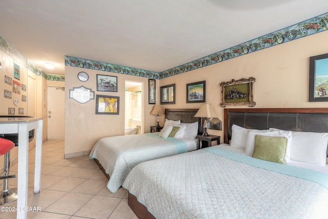 tiled bedroom with connected bathroom