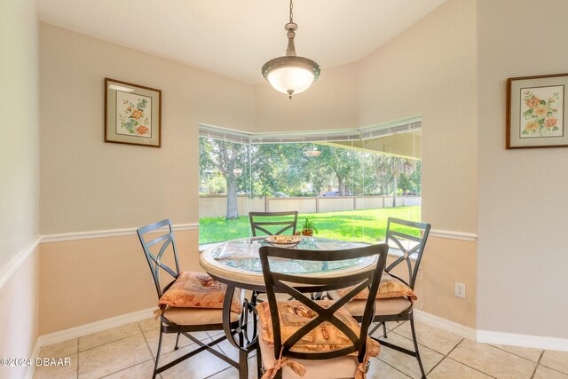 dining area featuring light tile patterned flooring