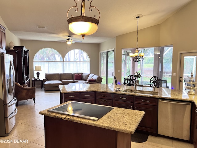 6382 Longlake Dr, Port Orange, FL 32128 - kitchen featuring appliances with stainless steel finishes, a sink, light tile patterned flooring, a kitchen island, and dark brown cabinetry