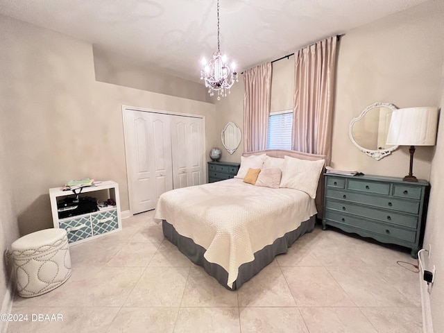 6382 Longlake Dr, Port Orange, FL 32128 - bedroom featuring a closet, light tile patterned flooring, and a chandelier