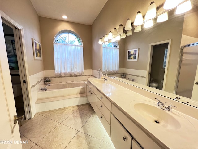 full bathroom with vanity, toilet, tile patterned flooring, and plus walk in shower