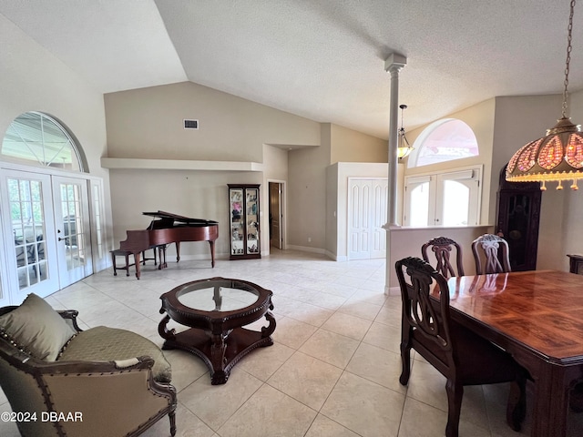 dining room with plenty of natural light, light tile patterned floors, and french doors