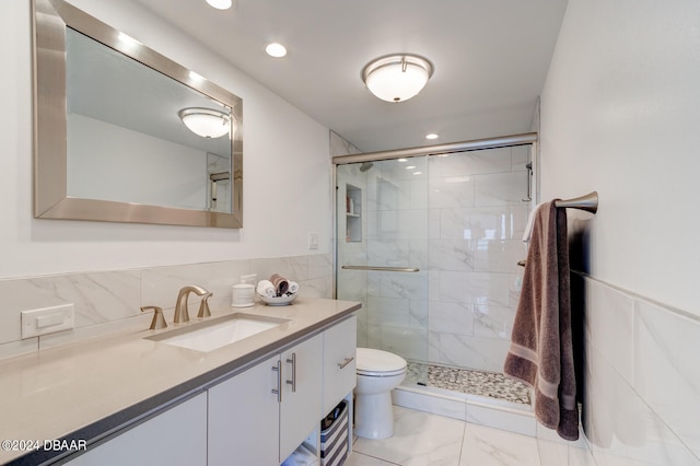 bathroom featuring vanity, toilet, and walk in shower