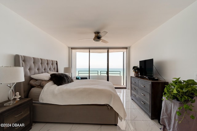 bedroom featuring access to exterior, expansive windows, and ceiling fan