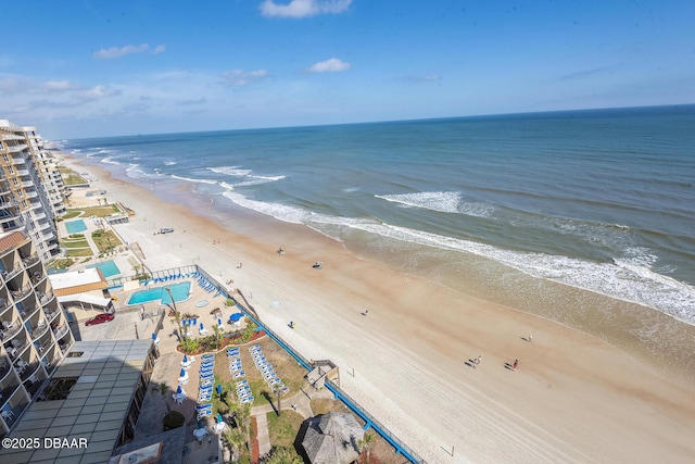 aerial view with a water view and a view of the beach