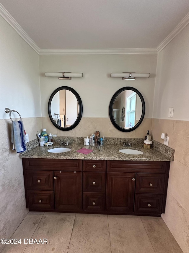 bathroom featuring vanity, tile patterned floors, tile walls, and crown molding