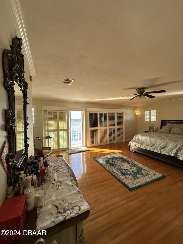 bedroom with ceiling fan and hardwood / wood-style floors