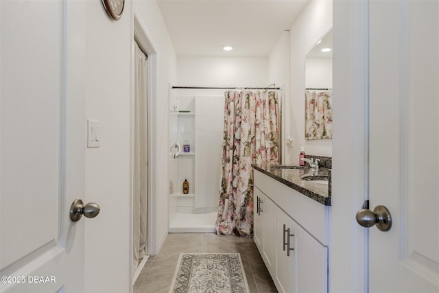 bathroom featuring a shower with curtain, vanity, and tile patterned flooring