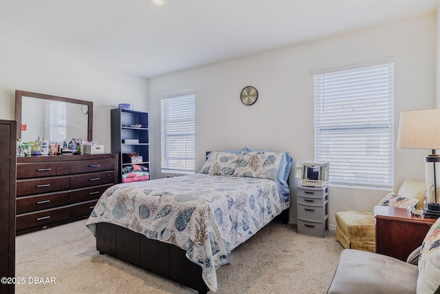 bedroom featuring light carpet