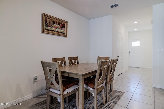 dining area featuring light tile patterned floors