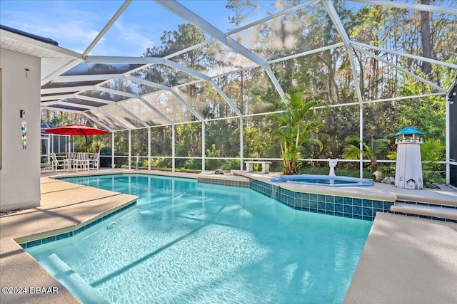 view of swimming pool with a lanai, an in ground hot tub, and a patio