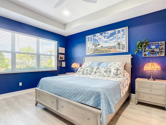 bedroom featuring ceiling fan and light hardwood / wood-style flooring