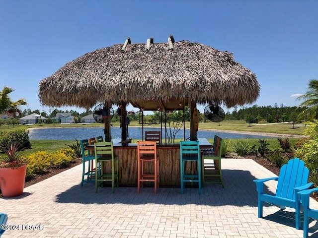 view of patio featuring a water view