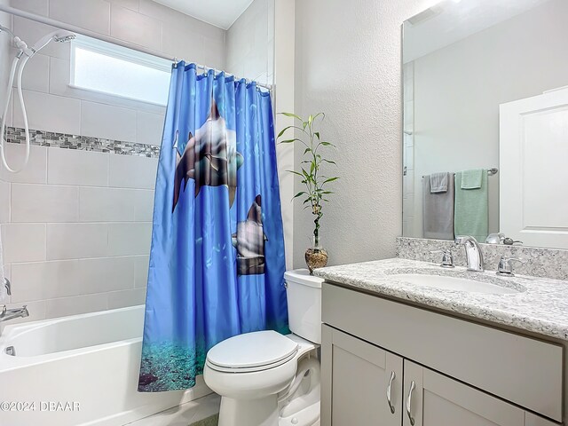 full bathroom with vanity, toilet, and shower / bath combination with curtain