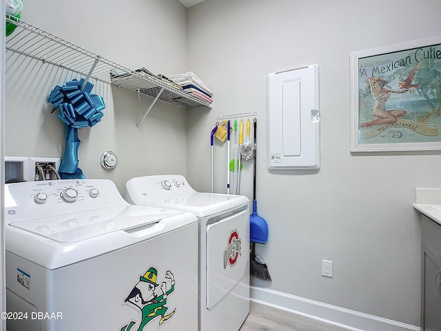 washroom featuring independent washer and dryer and light hardwood / wood-style flooring