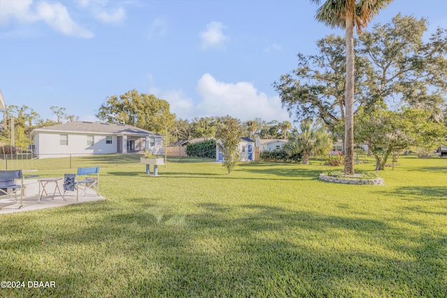 view of yard with a patio and fence