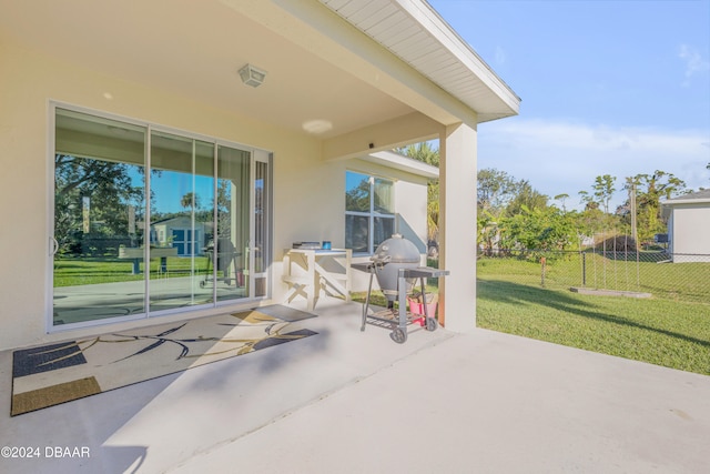 view of patio / terrace featuring grilling area and fence