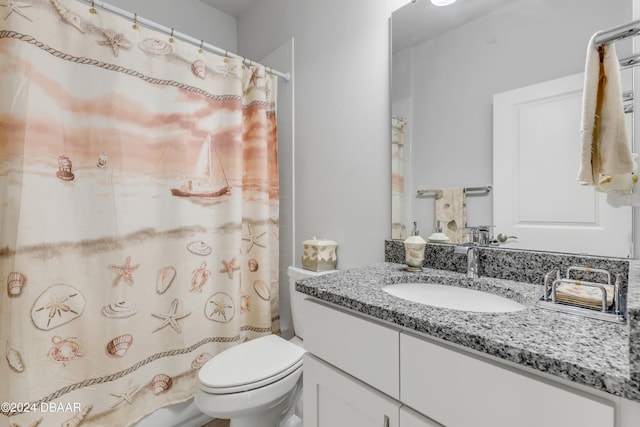 bathroom with vanity, toilet, and a shower with curtain