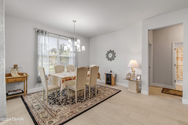 dining area with an inviting chandelier